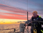 Flow's Marti at the helm during a glorious sunset