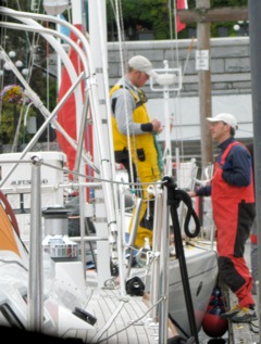 Seattle racers Nigel Barron (Red Sheila) and Alex Simanis (Terremoto!) trading tactics and strategy before start.  Photo courtesy of Candace Heckman.